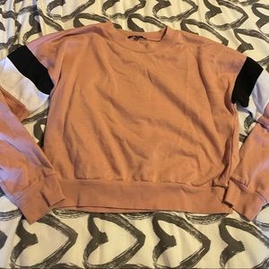Pink sweatshirt with black and white stripes on sleeves. Size medium. Forever 21